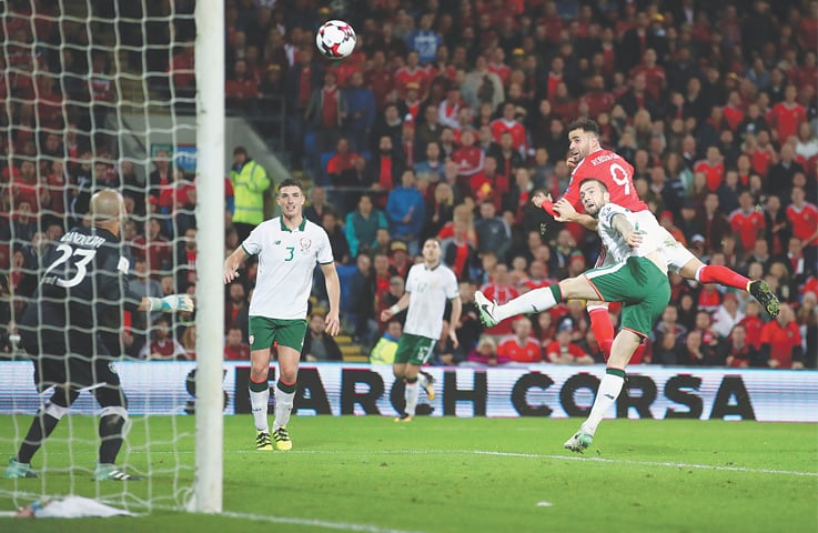 CARDIFF: Wales&rsquo; Hal Robson-Kanu heads the ball towards goal during their World Cup qualifier against Republic of Ireland at the Cardiff City Stadium.&mdash;AP