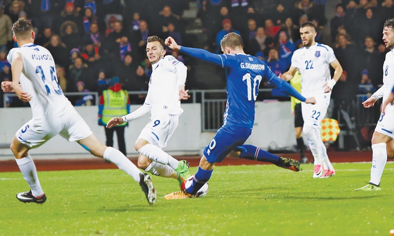 REYKJAVIK: Iceland&rsquo;s Gylfi Sigurdsson (C) shoots to score during their 2018 World Cup qualifier against Kosovo at the Laugardalsv&ouml;llur Stadium.&mdash;AP