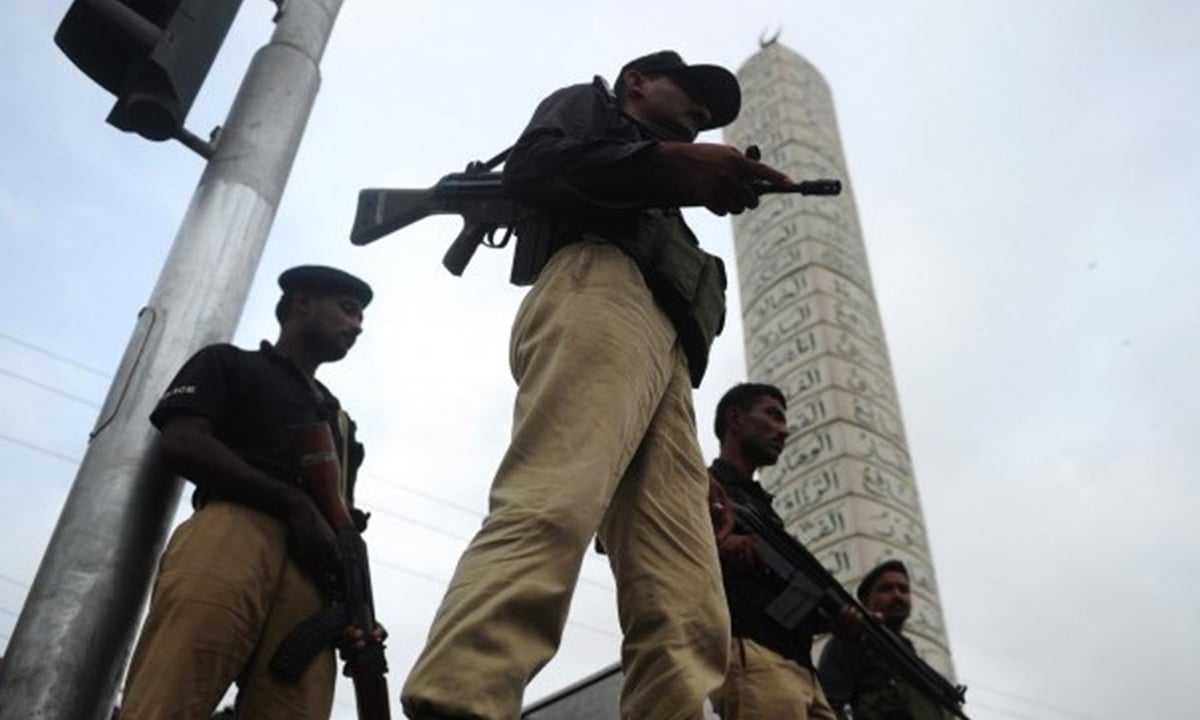 Police stand guard outside a mosque in Karachi | AFP