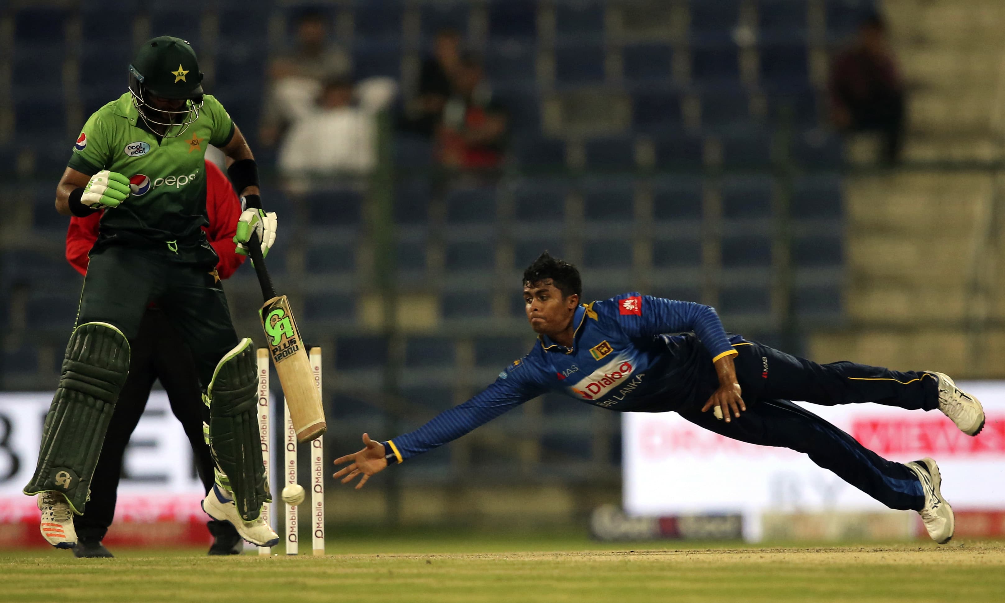 Jeffrey Vandersay dives to catch the ball during the third ODI match. —AP