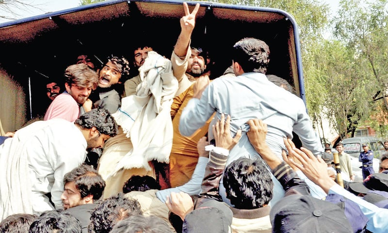 QAU students are detained by the Islamabad police on Monday. — White Star QAU students are detained by the Islamabad police on Monday. — White Star