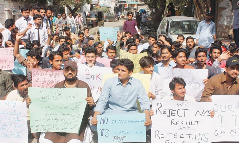 Candidates of NTS test hold a demonstration outside the press club in Hyderabad on Wednesday.—Online Candidates of NTS test hold a demonstration outside the press club in Hyderabad on Wednesday.—Online