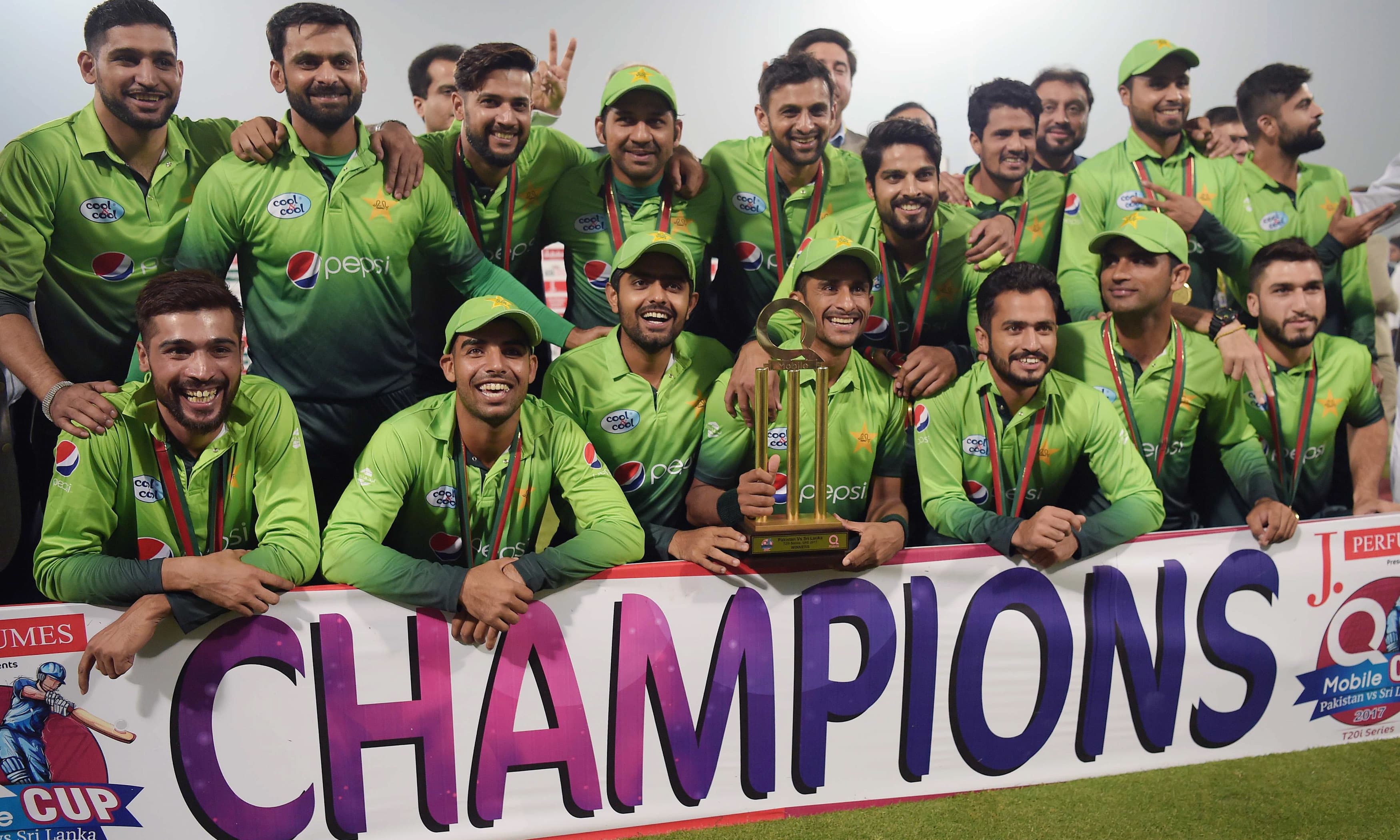 Pakistan's cricket team pose for photographs with the trophy after winning the third and final T20 cricket match against Sri Lanka. —AFP