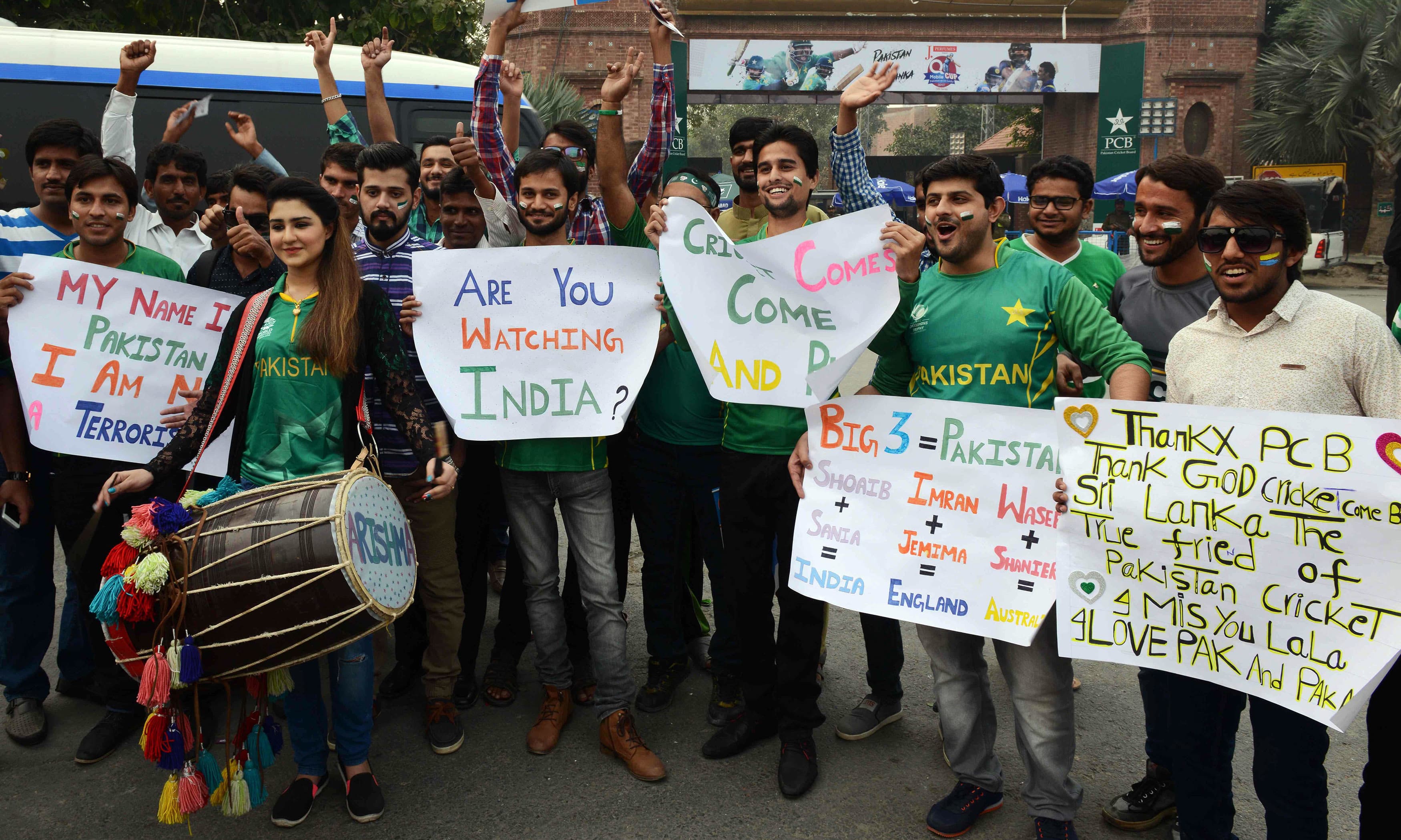 Spectators cheer prior to the start of the T20 cricket match. —AFP