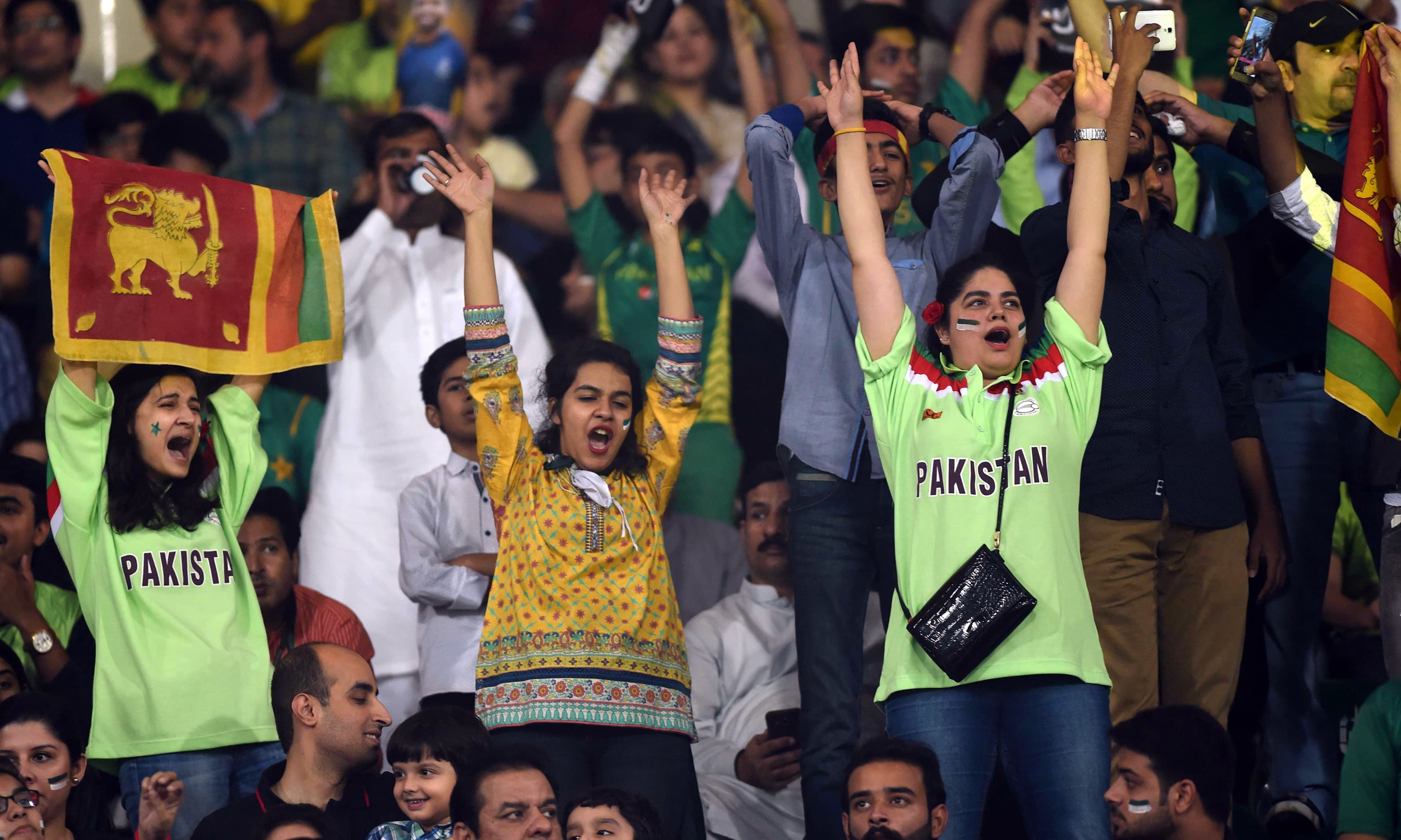 Spectators cheer during the T20 cricket match between Pakistan and Sri Lanka. —AFP