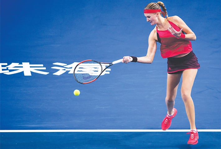 ZHUHAI: Kristina Mladenovic of France hits a return to Slovakia’s Magdalena Rybarikova during their match at the WTA Elite Trophy on Wednesday.—AFP