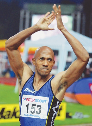 IN this file photo, Frankie Fredericks of Namibia celebrates his victory in the 100m final at the Gugl-Meeting in Linz, Austria in 2003.&mdash;Reuters