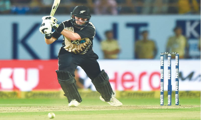 RAJKOT: New Zealand opener Colin Munro drives during his unbeaten century in the second T20 International against India on Saturday.&mdash;AFP