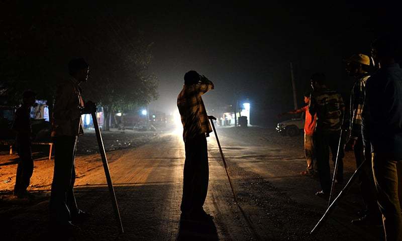 Volunteers of the vigilante group of Gau Raksha Dal (Cow Protection Squad) gather to inspect a truck on a highway in Rajasthan. &mdash; AFP/File