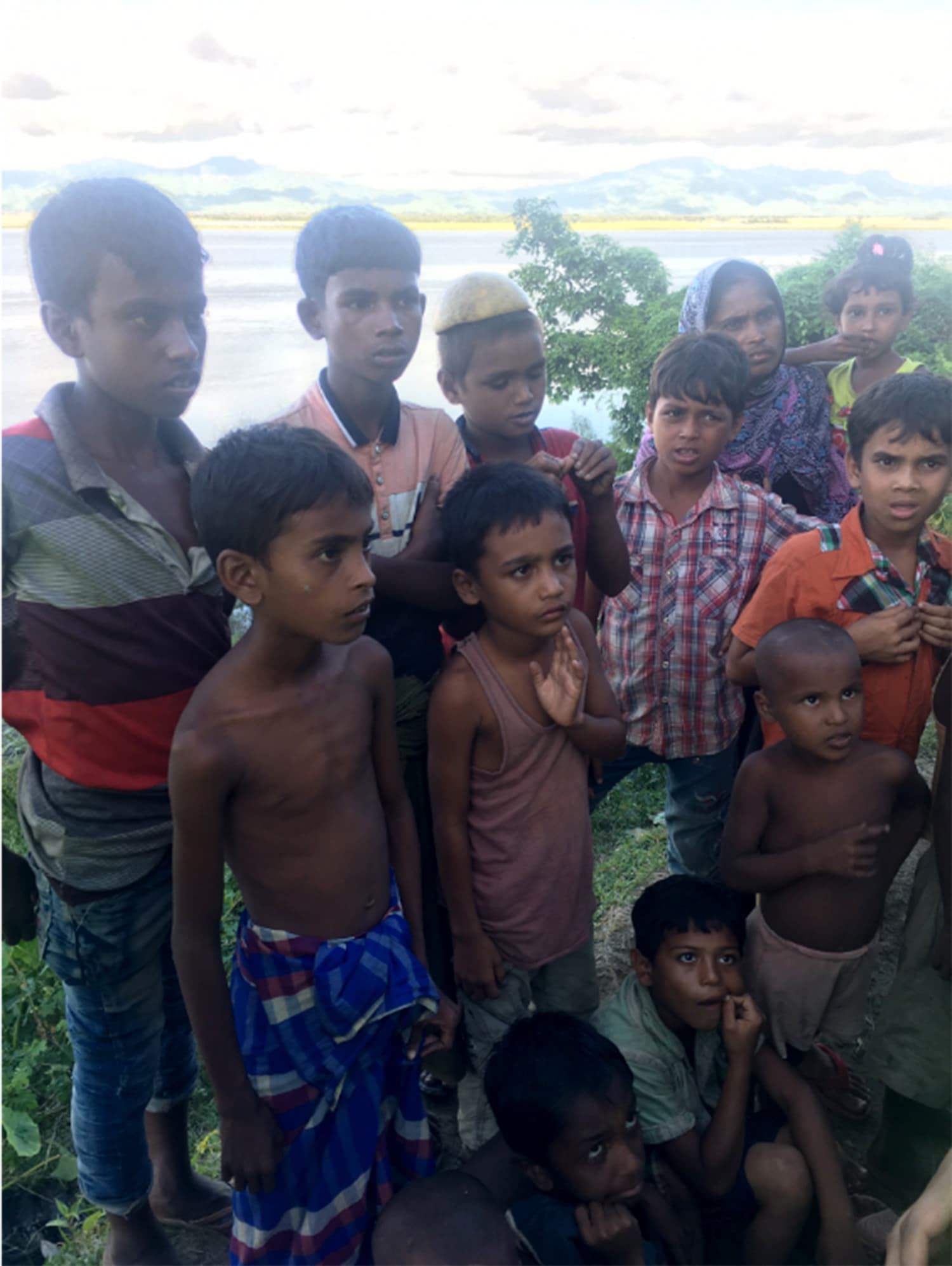 These children just crossed the Naf River to Bangladesh a few hours prior to this picture being taken. Myanmar can be seen in the background.