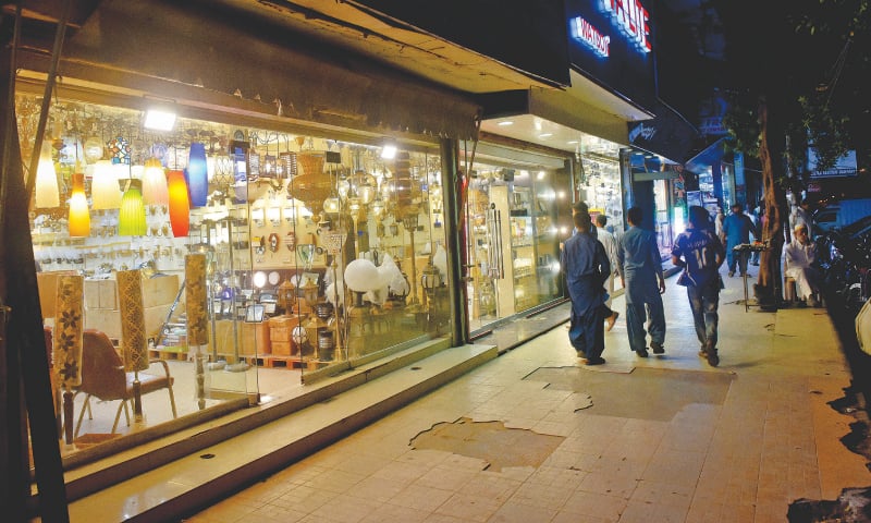 a row of shops selling electric light fixtures on M.A. Jinnah Road.