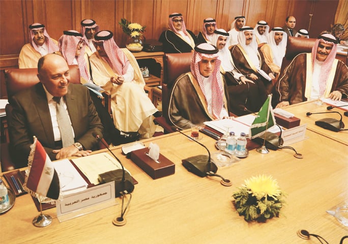 Cairo: Saudi Arabia’s Foreign Minister Adel al-Jubeir (centre) and Egyptian Foreign Minister Sameh Shoukry (left) meet at the Arab League headquarters on Sunday.—AP