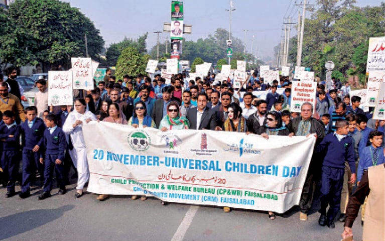 FAISALABAD: A walk to mark the Universal Children&rsquo;s Day. &mdash; Online