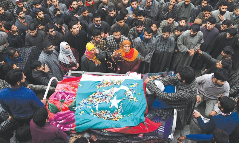 TRAL (Occupied Kashmir): Villagers surround the body of a suspected militant, Adil Chopan, during his funeral here on Tuesday. Mr Chopan was allegedly killed in a gunfight with Indian government forces.&mdash;AFP