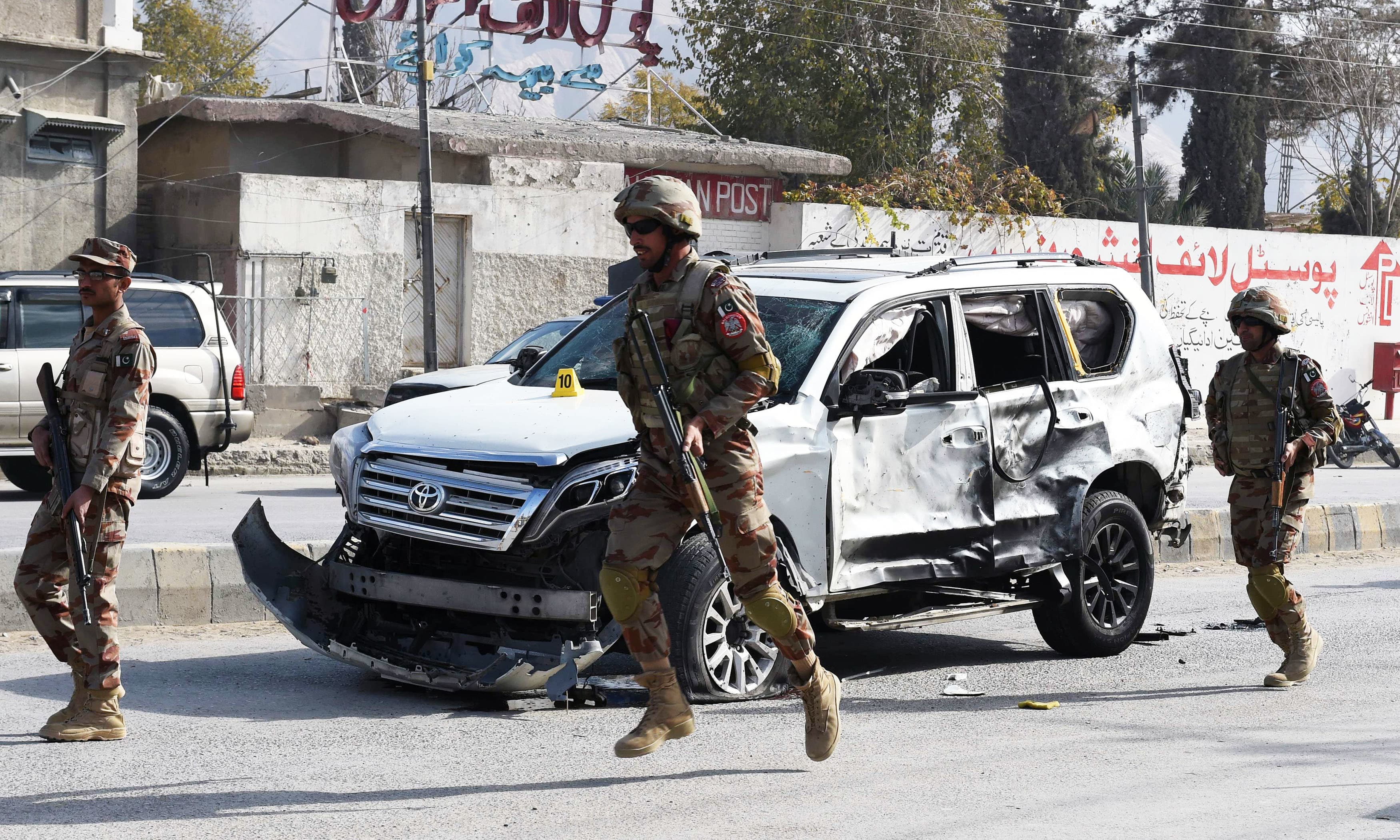 Soldiers arrive at the site of a suicide bombing in Quetta. — AFP