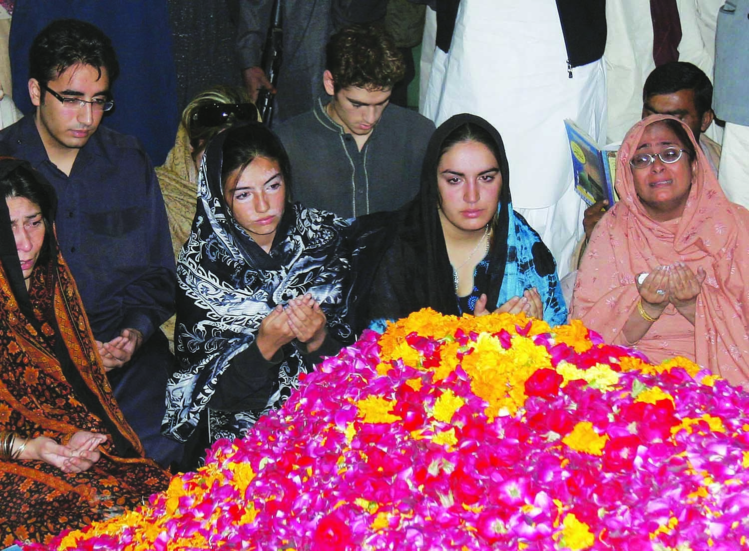 The assassination of Benazir Bhutto in Rawalpindi towards the end of 2007 led to a wave of sympathy for the party she used to lead – the Pakistan People’s Party – and, subsequently, to Musharraf’s ouster from the presidency. Bilawal Zardari (second from left), seen here grieving alongside sisters Asefa (centre) and Bakhtawar (second from right) at the gravesite of their mother in Garhi Khuda Bux, subsequently had to begin a life in politics, under the wings of father Asif Zardari, to take the Bhutto mantle forward. | Photo by Shakil Adil