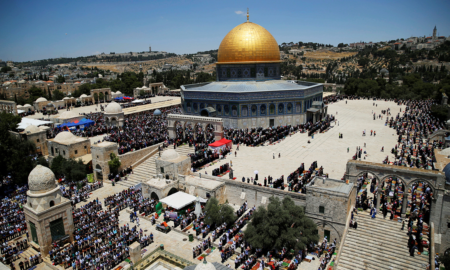 The Dome of the Rock is seen in the background as Palestinians pray in Jerusalem's Old City. Reuters/File