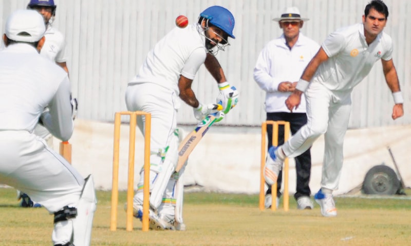 HYDERABAD: SNGPL batsman Asad Shafiq plays defensively against Lahore Whites’ paceman Waqas Ahmed during Super Eight round match of the Quaid-i-Azam Trophy National Cricket Championship at the Niaz Stadium on Saturday.—INP HYDERABAD: SNGPL batsman Asad Shafiq plays defensively against Lahore Whites’ paceman Waqas Ahmed during Super Eight round match of the Quaid-i-Azam Trophy National Cricket Championship at the Niaz Stadium on Saturday.—INP