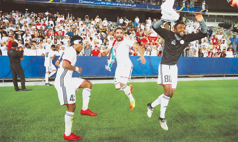 ABU DHABI: Al Jazira&rsquo;s (L to R) Ahmed Rabee, Salem Rashid and Salem Ali Ibrahim celebrate at the end of their FIFA Club World Cup match against Urawa Red Diamonds at the Zayed Sports City Stadium.&mdash;Reuters