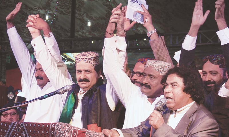 MNA Asad Malik (second from left) along with his associates makes a gesture at a reception in Kotri on Saturday evening.—Online MNA Asad Malik (second from left) along with his associates makes a gesture at a reception in Kotri on Saturday evening.—Online