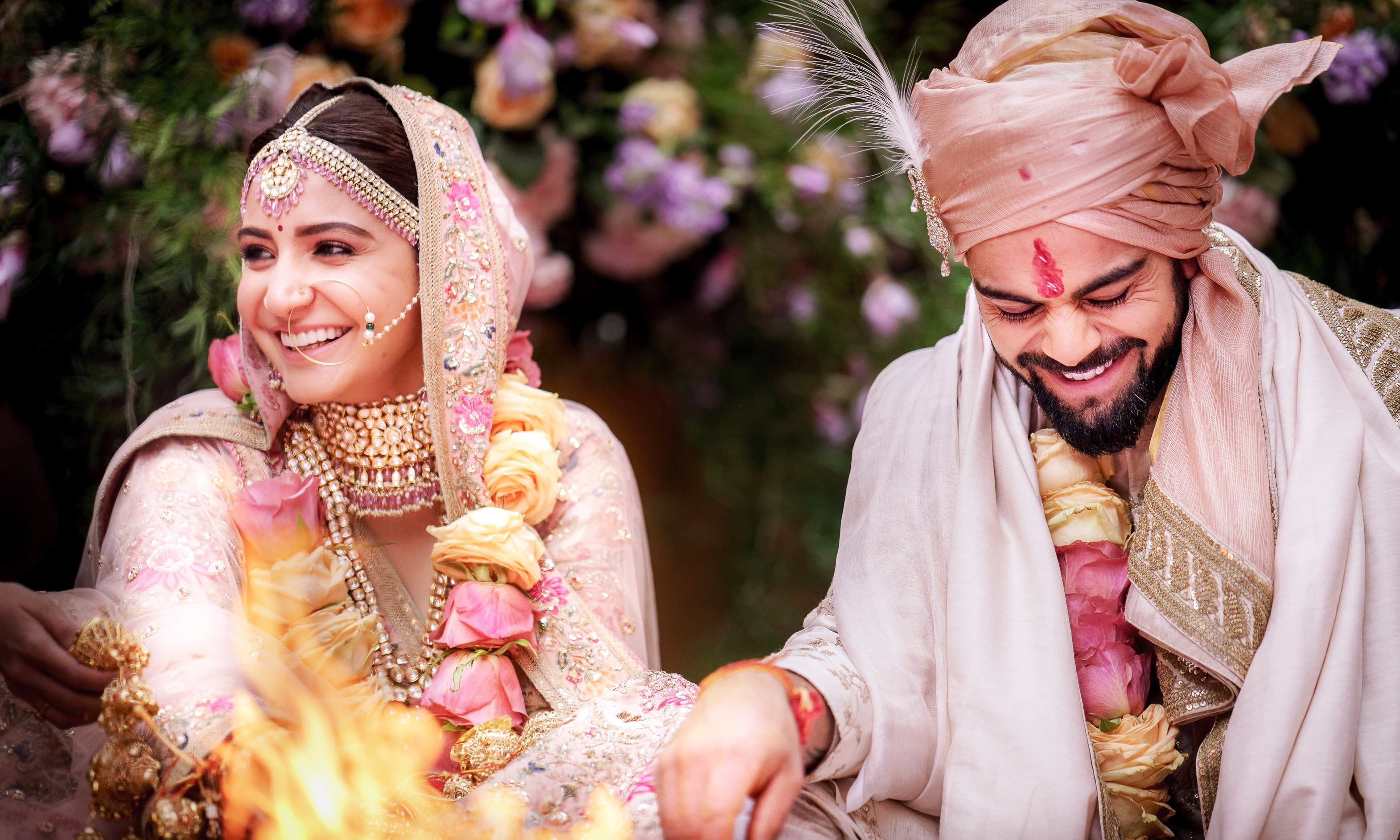 Virat Kohli and Anushka Sharma performing their wedding rituals in Buoncovento near Siena. —AFP