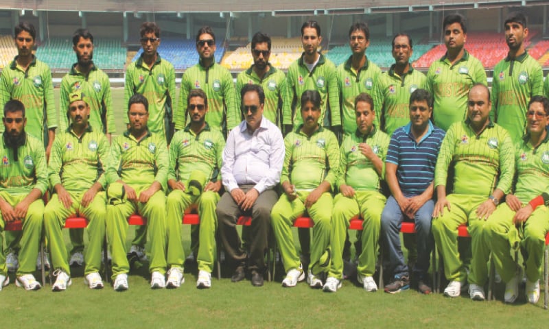 MEMBERS of national blind cricket squad pose for a group photo.