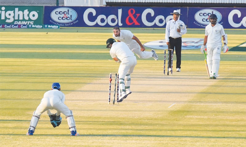KARACHI: Wapda&rsquo;s top-scorer Adnan Raees has no answer to this unplayable delivery from SNGPL seamer Samiullah Khan Niazi as non-striker Aamir Sajjad looks on during the Quaid-i-Azam Trophy National Cricket Championship final at the National Stadium on Friday.&mdash;Tahir Jamal/White Star