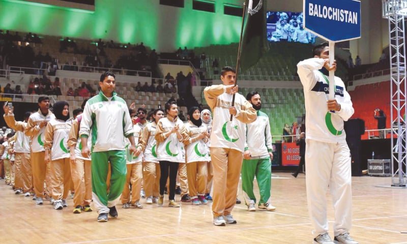 ATHLETES from Balochistan march out during the opening ceremony.—APP