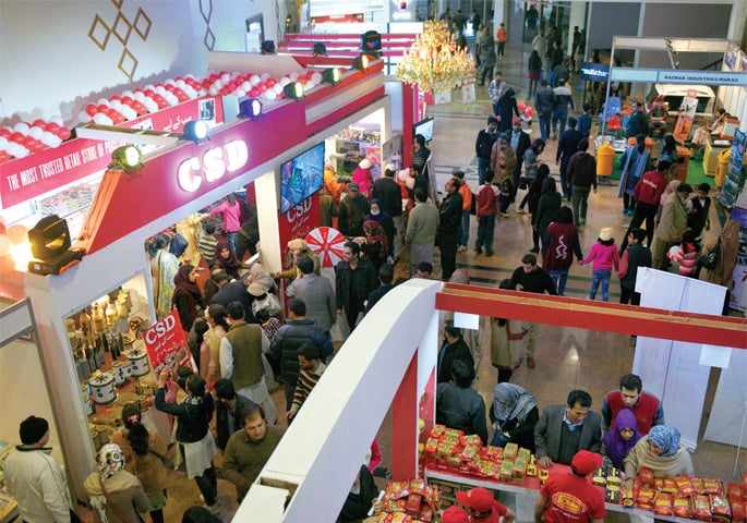 People visit stalls at All About Lifestyles Exhibition on Saturday. The other picture is from the German Shepherd Landesgruppen Show. — White Star