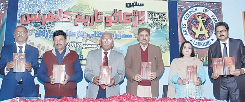 GUESTS display the book launched at the conference.&mdash;Dawn