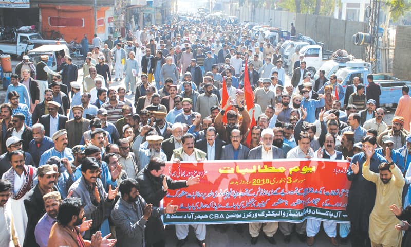 activists of the All Pakistan Wapda Hydro Electric Workers Union (CBA) stage a rally in Hyderabad.—Dawn activists of the All Pakistan Wapda Hydro Electric Workers Union (CBA) stage a rally in Hyderabad.—Dawn