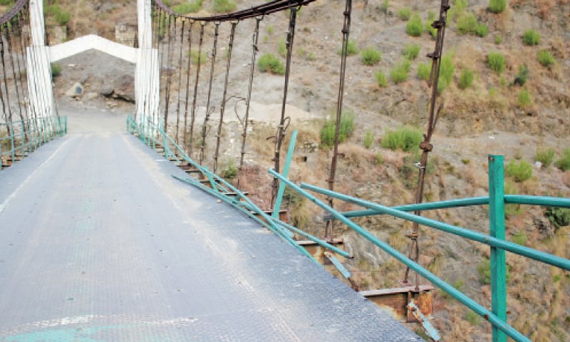 The damaged Kormang bridge in Bisham. &mdash; Dawn