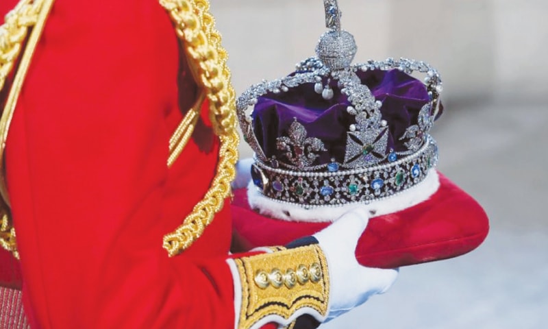 BRITAIN’S Queen Elizabeth II wears the Imperial State Crown during her traditional speeches for the State Opening of Parliament .—AFP