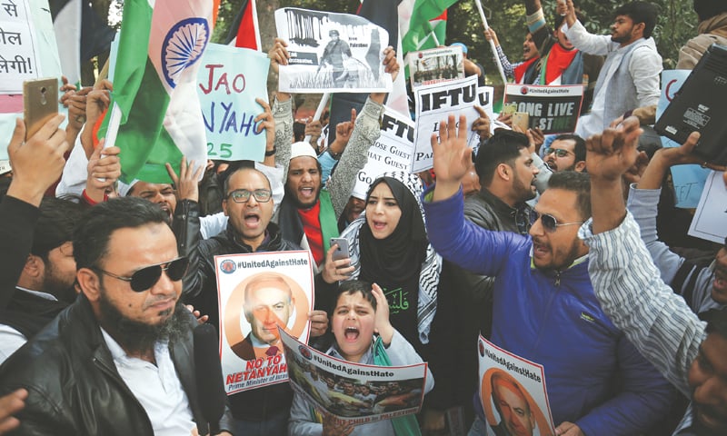 NEW DELHI: Civil rights activists protest against the visit of Israeli Prime Minister Benjamin Netanyahu near the Israeli embassy on Monday.—AP