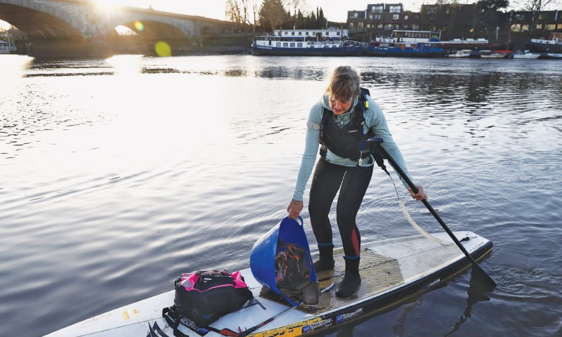 LOUISE Nolan, a founder of the paddle-board association Active360, holds a bucket of rubbish which she picked up in less than an hour during a collection of discarded plastic and rubbish from the banks of the Thames, near Kew Bridge, west London, on Jan 16.&mdash;AFP