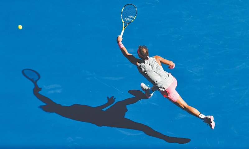 MELBOURNE: Rafael Nadal of Spain plays a forehand return to Argentina’s Leonardo Mayer during their match at the Australian Open on Wednesday.—AFP