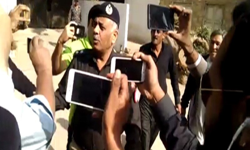 SSP Malir Rao Anwar talks to media on his way to DIG CTD's office.—DawnNews