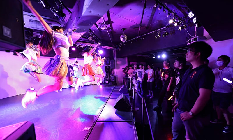 This photo taken on July 29, 2017 shows adults watching a concert by an idol group in Tokyo. &mdash; AFP