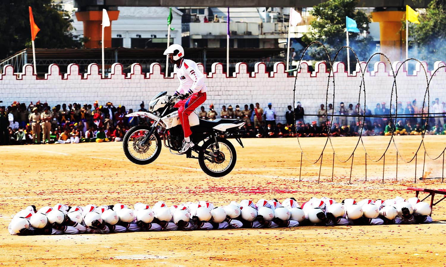 Shwetha Ashwas of the Indian Military Police performs stunts during Republic Day celebrations in Bangalore.—AFP