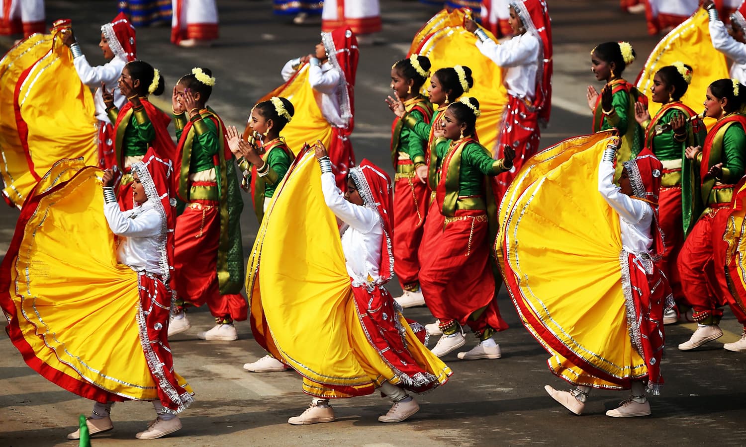 Indian school students perform during India's 69th Republic Day Parade in New Delhi.—AFP