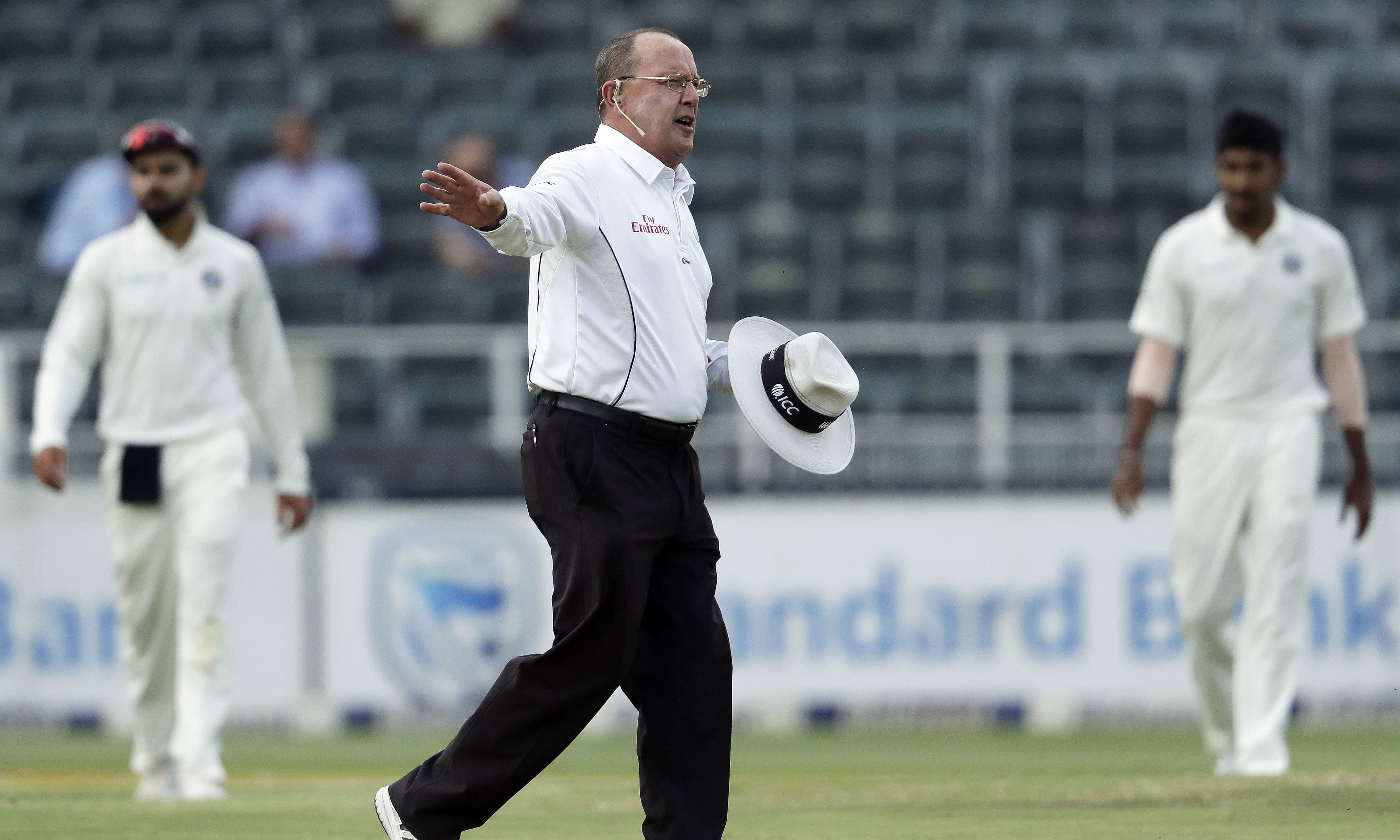 Umpire Ian Gough of England signals for the players to leave the field on the third day of the third Test between South Africa and India at the Wanderers Stadium in Johannesburg. —AP