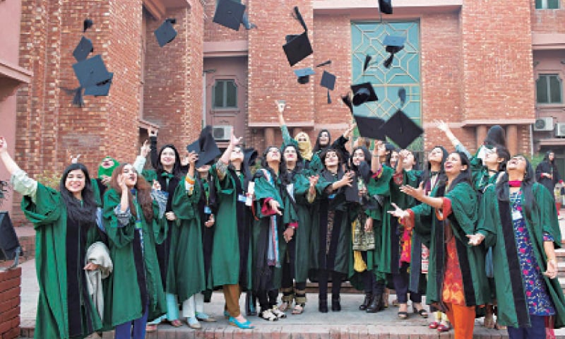 Graduates throw their mortar boards in the air at the convocation of the Lahore College for Women University. &mdash; Online