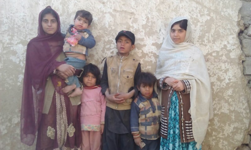 CHILDREN of slain polio worker Sakeena Bibi are standing at their house.—Photo by writer