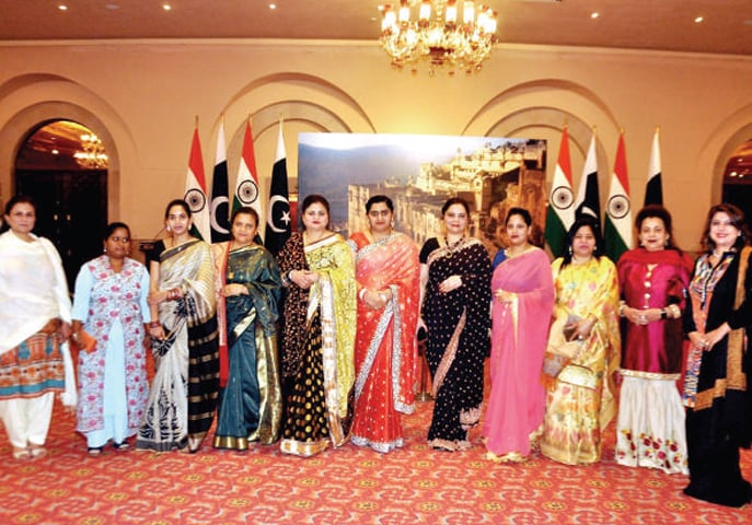 Women celebrate the Indian Republic Day in Islamabad.