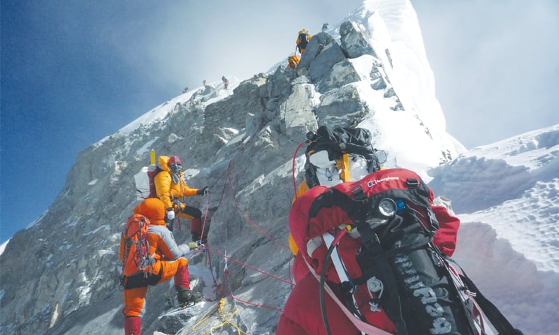 In this file photograph taken on May 19, 2009, mountaineers climb the south face of Mount Everest from Nepal.&mdash;AFP