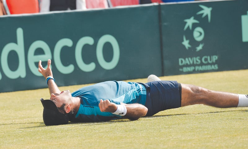 ISLAMABAD: Pakistan’s Aisam-ul-Haq falls on the floor in jubilation after beating top Korean player Soon Woo Kwon in their Davis Cup singles match on Friday.—photo by White Star/Tanveer Shahzad ISLAMABAD: Pakistan’s Aisam-ul-Haq falls on the floor in jubilation after beating top Korean player Soon Woo Kwon in their Davis Cup singles match on Friday.—photo by White Star/Tanveer Shahzad