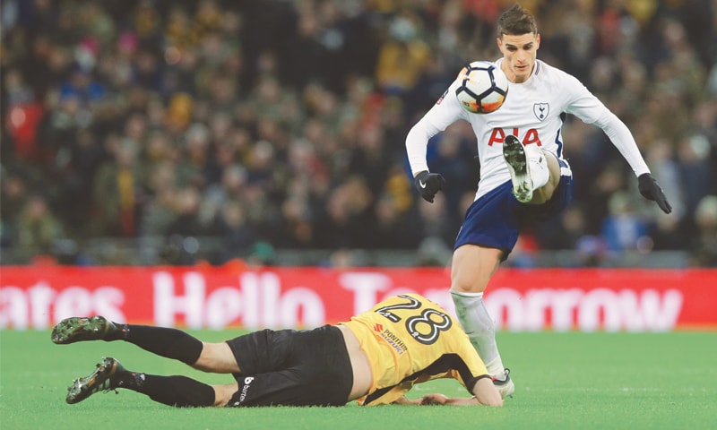 LONDON: Tottenham&rsquo;s Erik Lamela (R) gets past Newport&rsquo;s Mickey Demetriou during the FA Cup replay at the Wembley Stadium.&mdash;AP