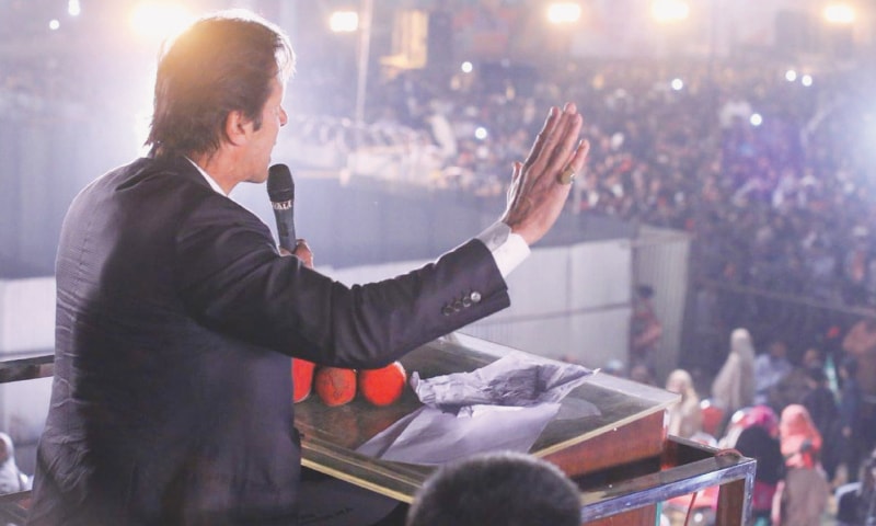 LODHRAN: Pakistan Tehreek-i-Insaf chairman Imran Khan addressing a rally held here on Friday as part of campaigning for by-election in the NA-154 constituency.—Online