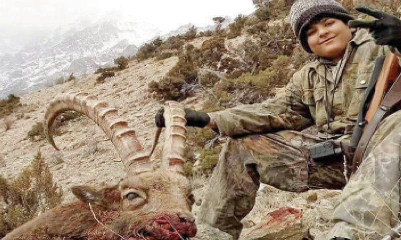 Imam Haroon along with his trophy in Gojal valley, upper Hunza. &mdash; Dawn