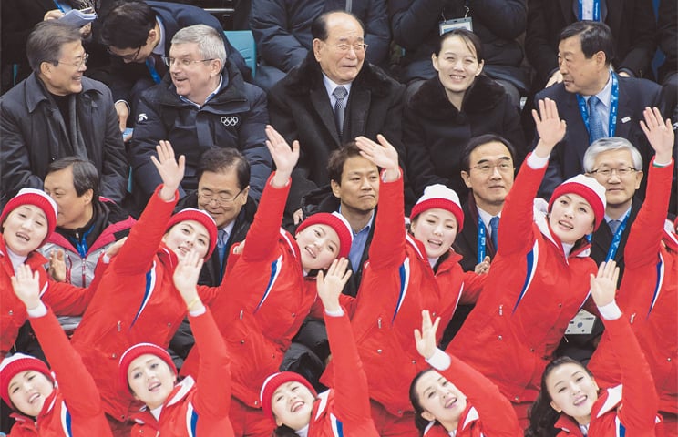 NORTH Korean cheerleaders perform before (top left to right) South Korean President Moon Jae-in, International Olympic Committee President Thomas Bach, Presidium of the Supreme Peoples Assembly of North Korea President Kim Yong-nam, Kim Yo-jong, the younger sister of North Korea&rsquo;s leader Kim Jong-un, and Pyeongchang Organising Committee President Lee Hee-Beom during the women&rsquo;s ice hockey match between the unified Korea and Switzerland at the Pyeongchang 2018 Winter Olympics on Feb 10.&mdash;AFP